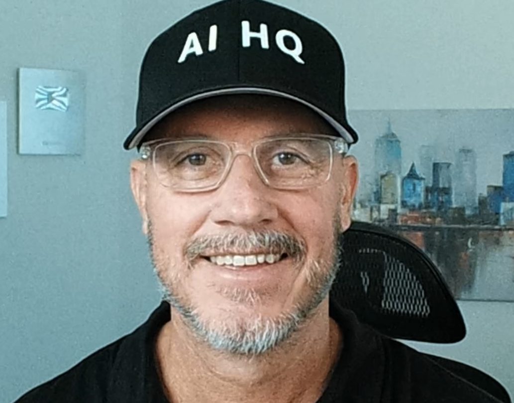 Tyler Pratt wearing an AI HQ hat